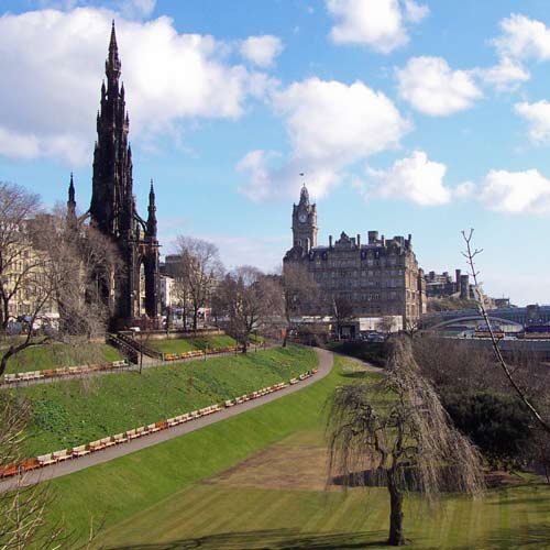 Clocktower of Balmoral Hotel and Scott Monument seen from Princes Street Gardens